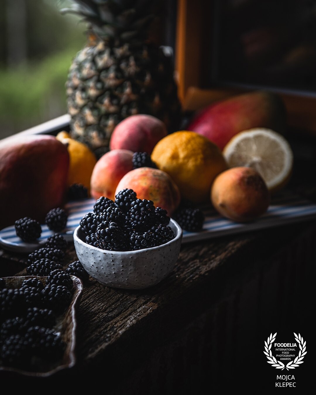 An abundance of fruit on the window's shelf in a beautiful house on the hill. <br />
It was a beautiful rainy day, perfect for moody captures.
