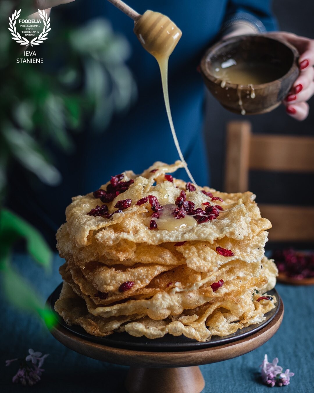 A photo for a client of a traditional Lithuanian dessert, called anthill cake. I decided to include essential ingredients of this dessert by pouring honey and using some more cranberries in the shot.