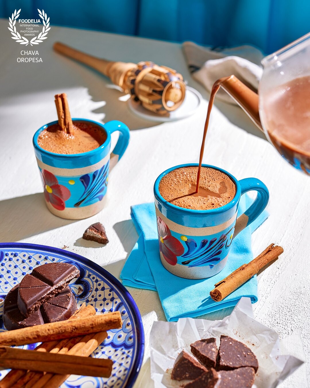 "Champurrado" is a traditional Mexican beverage made with corn masa, water, chocolate and sweetened with piloncillo. It has a thick rich texture and is usually served warm to accompany tamales or churros. <br />
Image created for a Christmas editorial for VegNew Magazine Holiday issue.