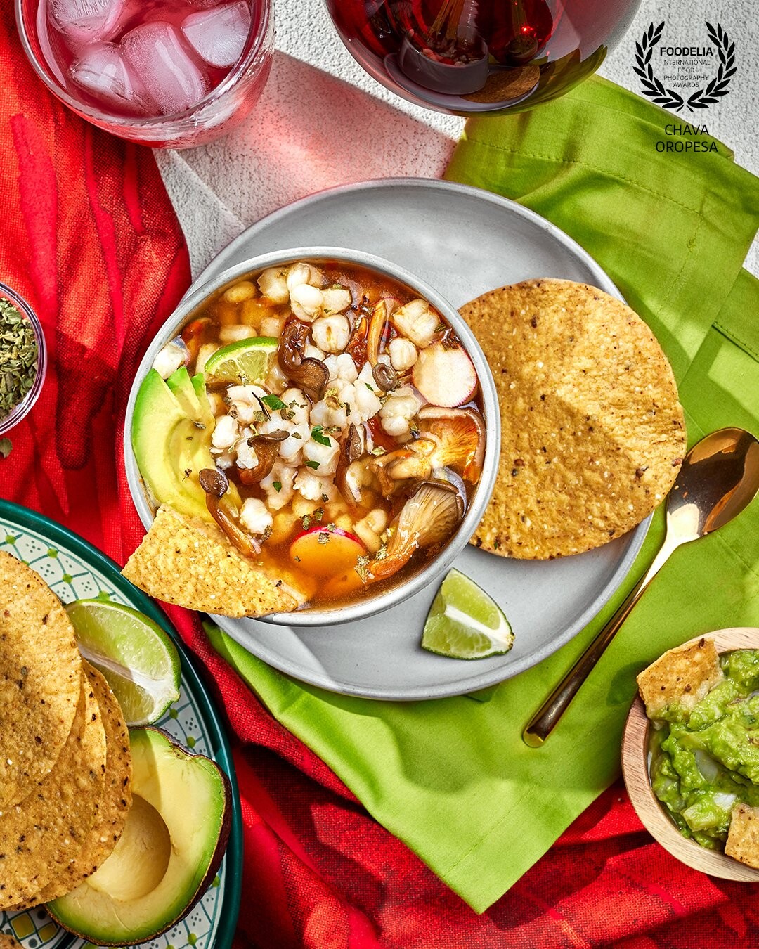 Pozole is probably the most traditional Mexican soup. It's served during celebrations and parties but it's also a big staple of everyday Mexican food. Primarily made with hominy, chicken or pork then topped with shredded lettuce, avocado, oregano, and radishes. This version was made with mushrooms, for VegNews magazine Christmas issue.