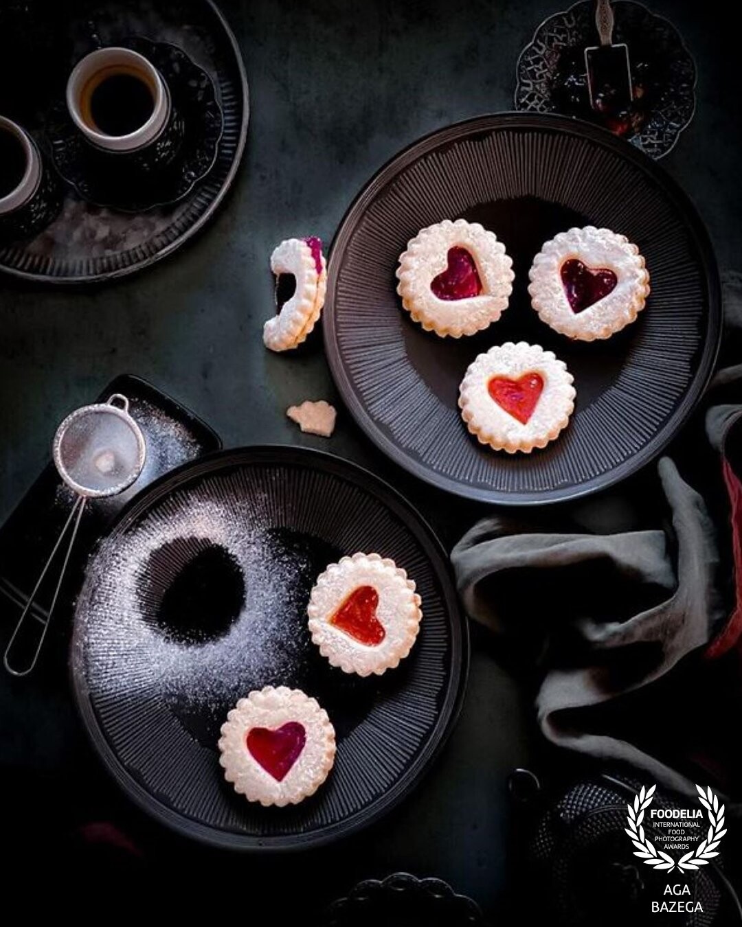 Heart shaped cookies with orange and raspberry filling. The image created in my photography studio for photography contest. Captured with natural light.