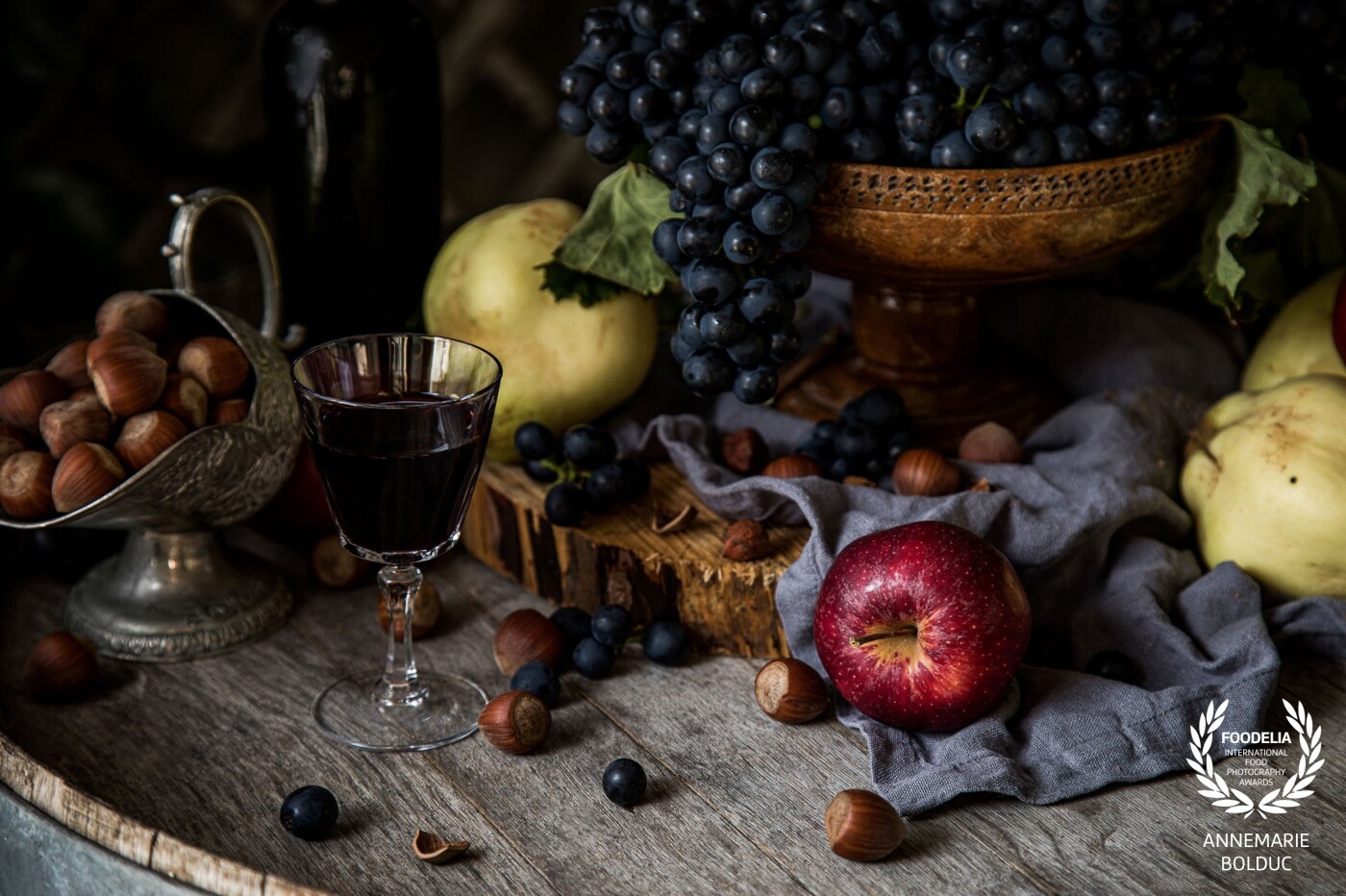 In Tumbarumba, in the foothills of the Australian Alps, cool climate wines, fruits and nuts are a speciality. Magic happened one afternoon when some fresh shiraz grapes, apples, quinces and shelled hazelnuts came to my studio. Photographed with natural light, just before dark, with time for a glass of wine. Santé!