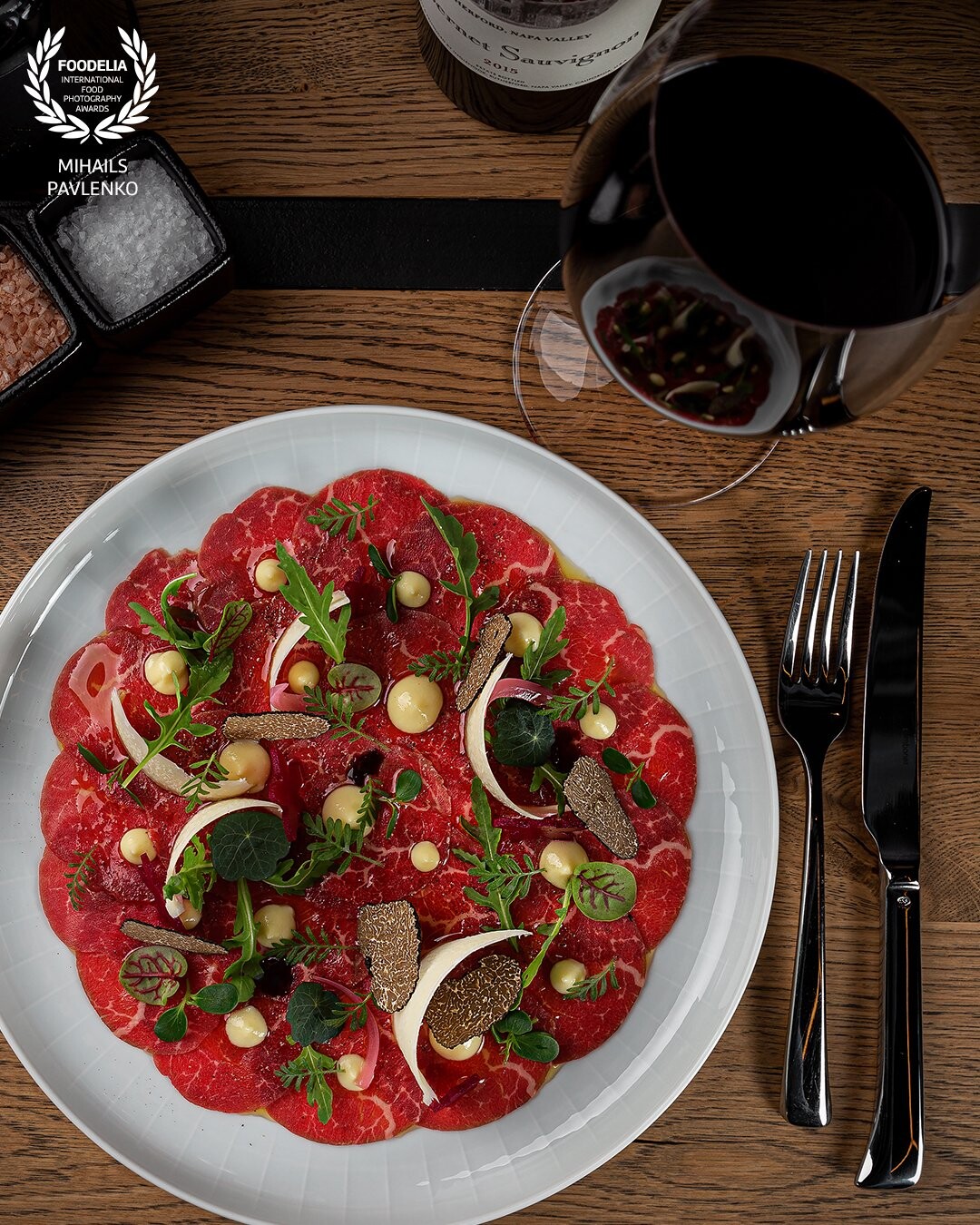 Photo shoot of meal and at Riga's restaurant Tauro @tauro_latvia in sophisticated lighting. Wonderful carpaccio plate with truffle, Maldon salt un black pepper.