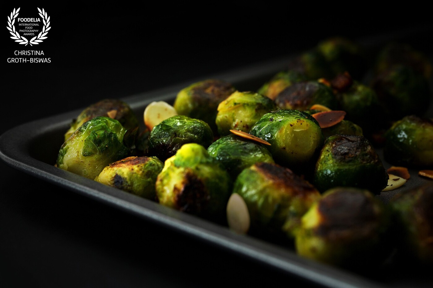 Close-up of a tray with roasted brussel sprouts, almonds and pancetta. This vegetable isn’t everyone’s favourite so I was trying to portrait it in a way that maybe change at least one persons mind and make them want to try it. I hope I accomplished my mission with this picture.