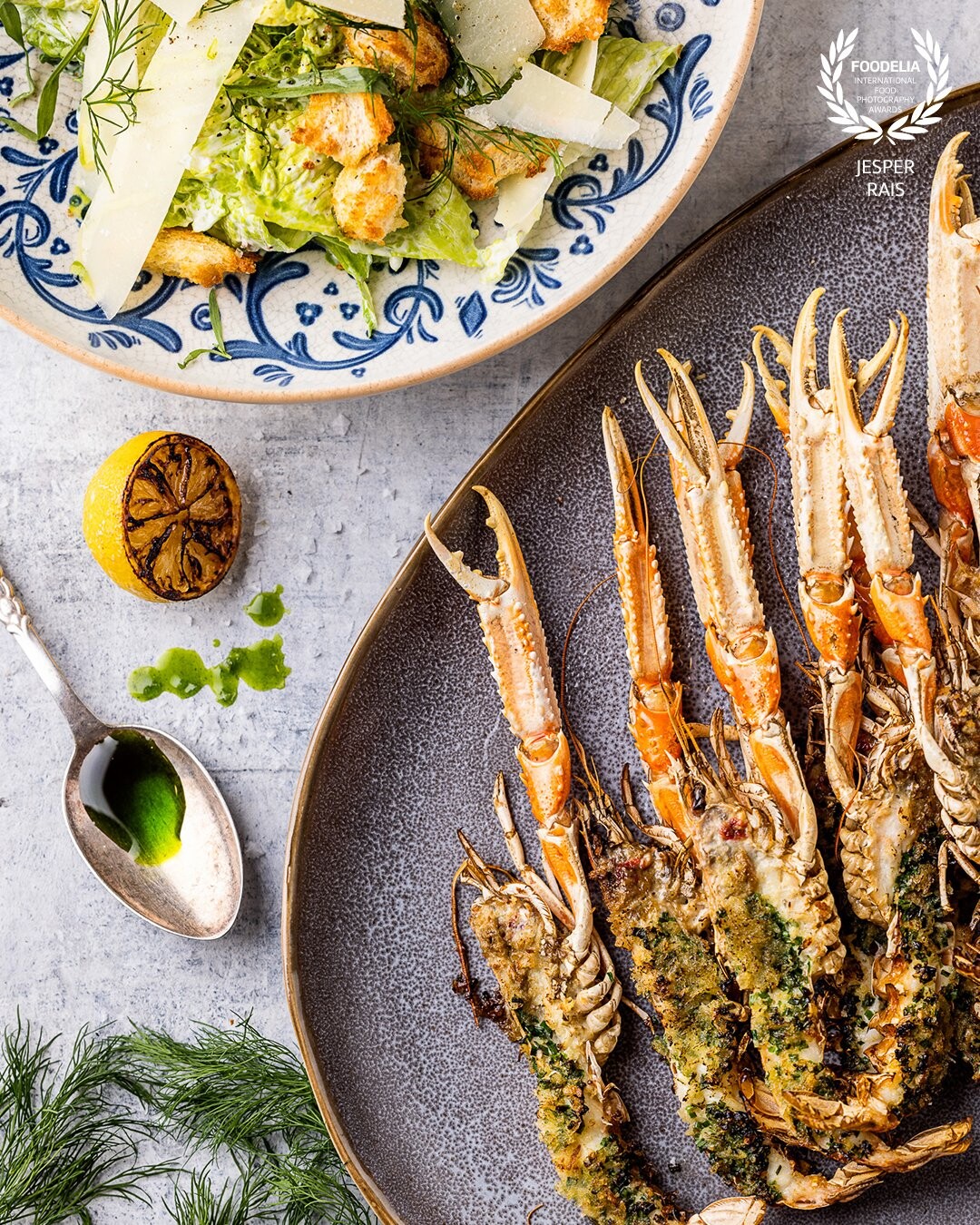 Grilled langoustine made with a salad "Caesar-style" from the newest book "SHELLFISH" by photographer @raisfoto and chef @dennisrafn from Denmark