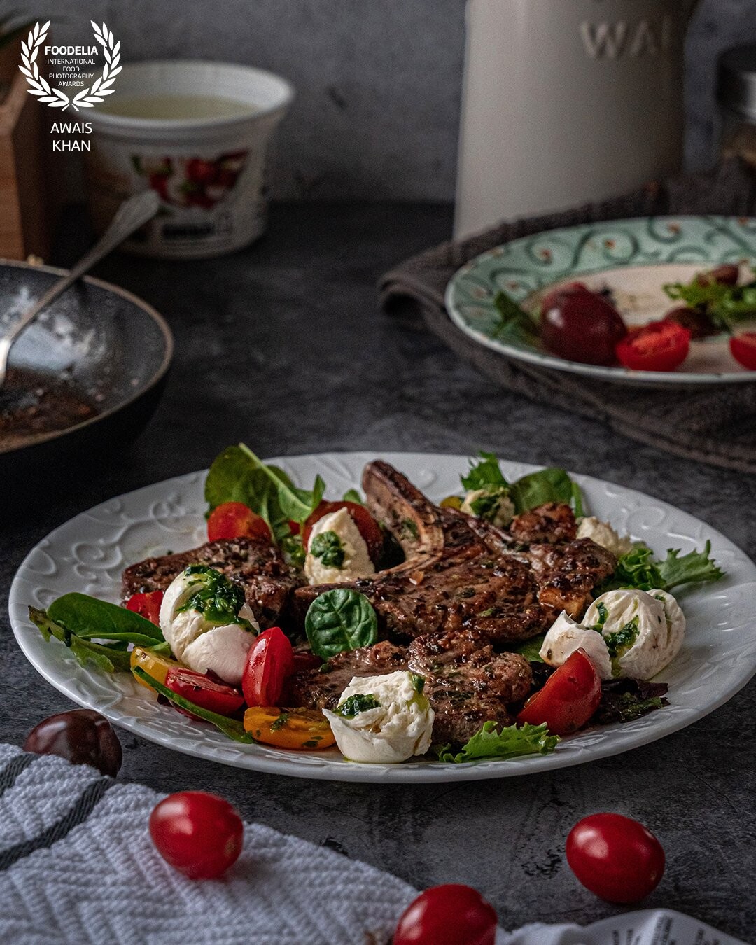 Grilled Lamb, tomato bocconcini salad, and herb oil all dressed up for dinner. I wanted the salad to pop colour into this picture without taking up too much space.