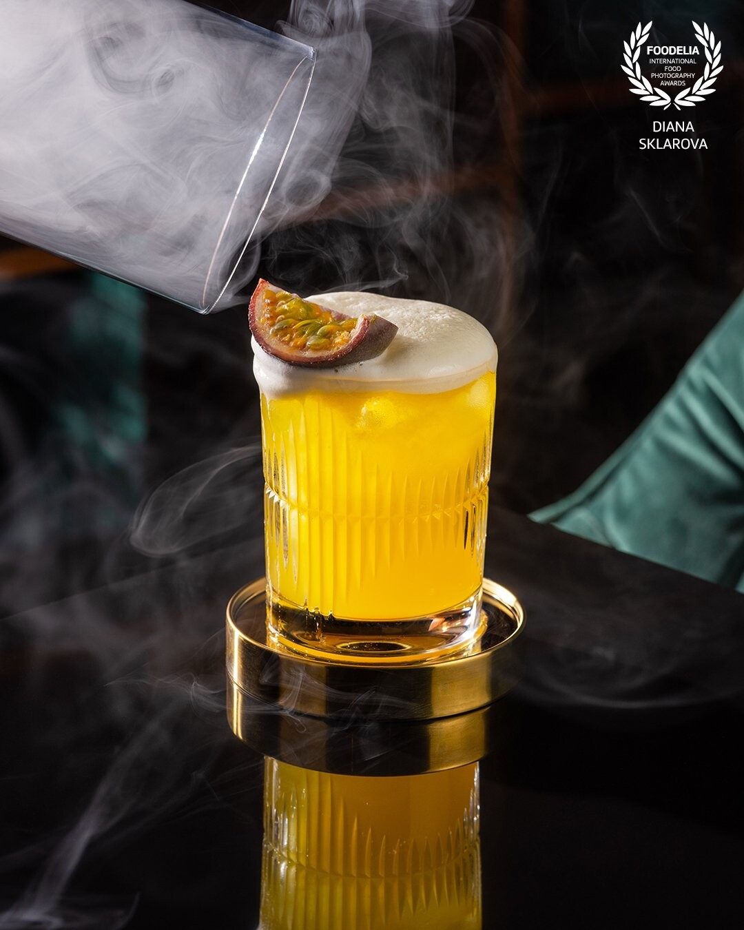 Non alcoholic cocktail Varadero with beautiful presentation with steam on black glass table. Photo made for new drink card - "Bambook" restaurant placed in Riga.