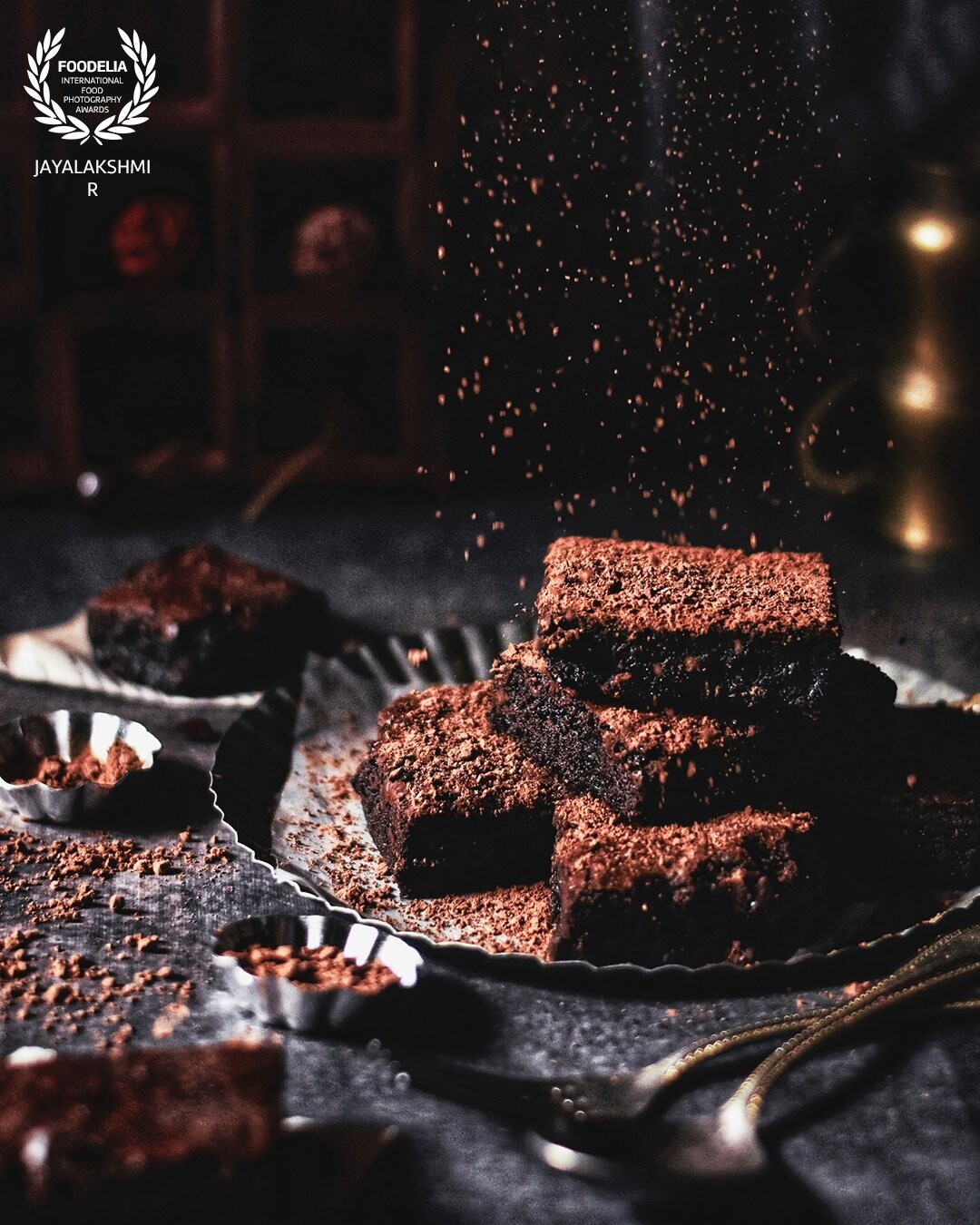 Some brownies for the festive season . Added some drama  to the scene by doing a  cocoa dusting . Shot in natural light against a west facing window.