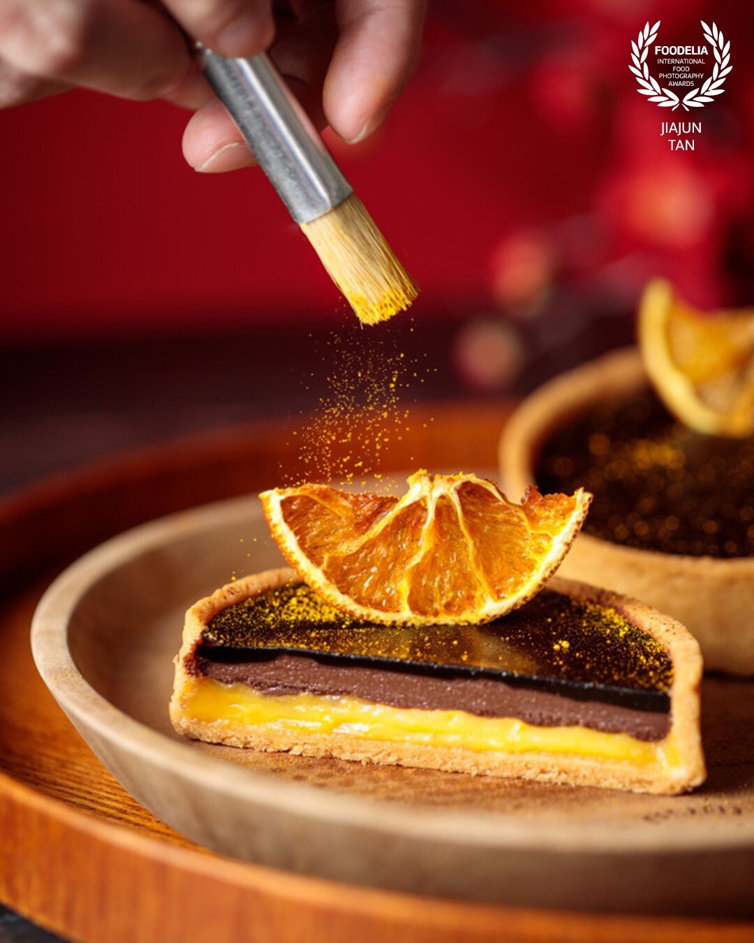Stunning Orange Chocolate Tart from Tanamera Coffee Singapore.<br />
<br />
Milk chocolate filling, orange custard and dark chocolate ganache encrusted in cookie shell with a little touch of magical golden powder.<br />
<br />
Photographer:@jsquaree | @sparkstudio.co<br />
Cilent: @tanameracoffeesg