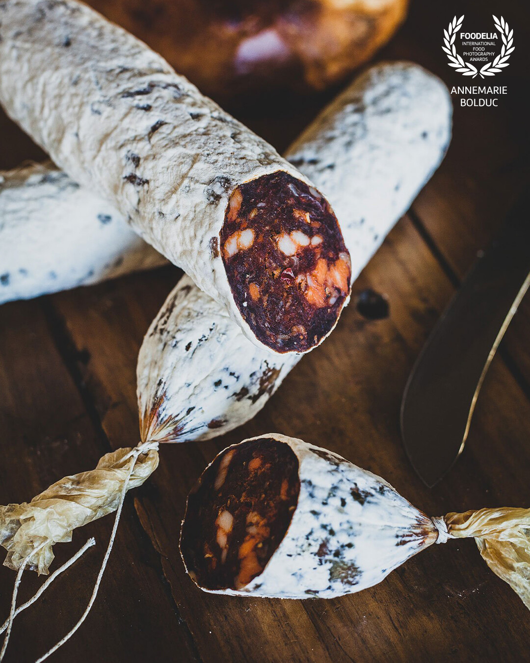 What I love about culinary photography is discovering and observing the process of foods, and telling a visual story. This salami was about to be removed from the moulded skin and was homemade by an Australian family who gathers each year to craft it.