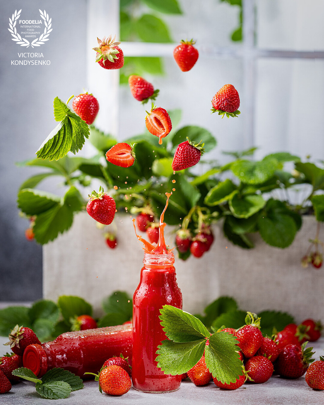 Advertising photo shoot of the local Ukrainian garden family farming . This organic pure strawberry juice.