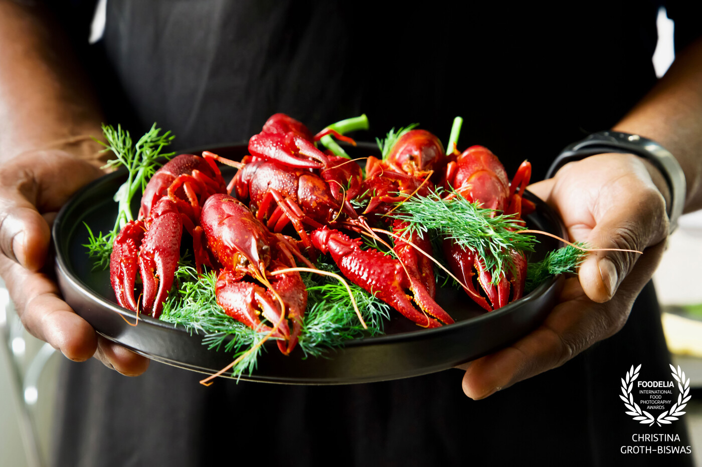 In my house, we traditionally eat crayfish at the time of summer solstice. I love the intense colour of the crayfish, together with  the dill, which I wanted to bring out without overpowering the image with too much colour or other noise. <br />
I used natural light for this image.