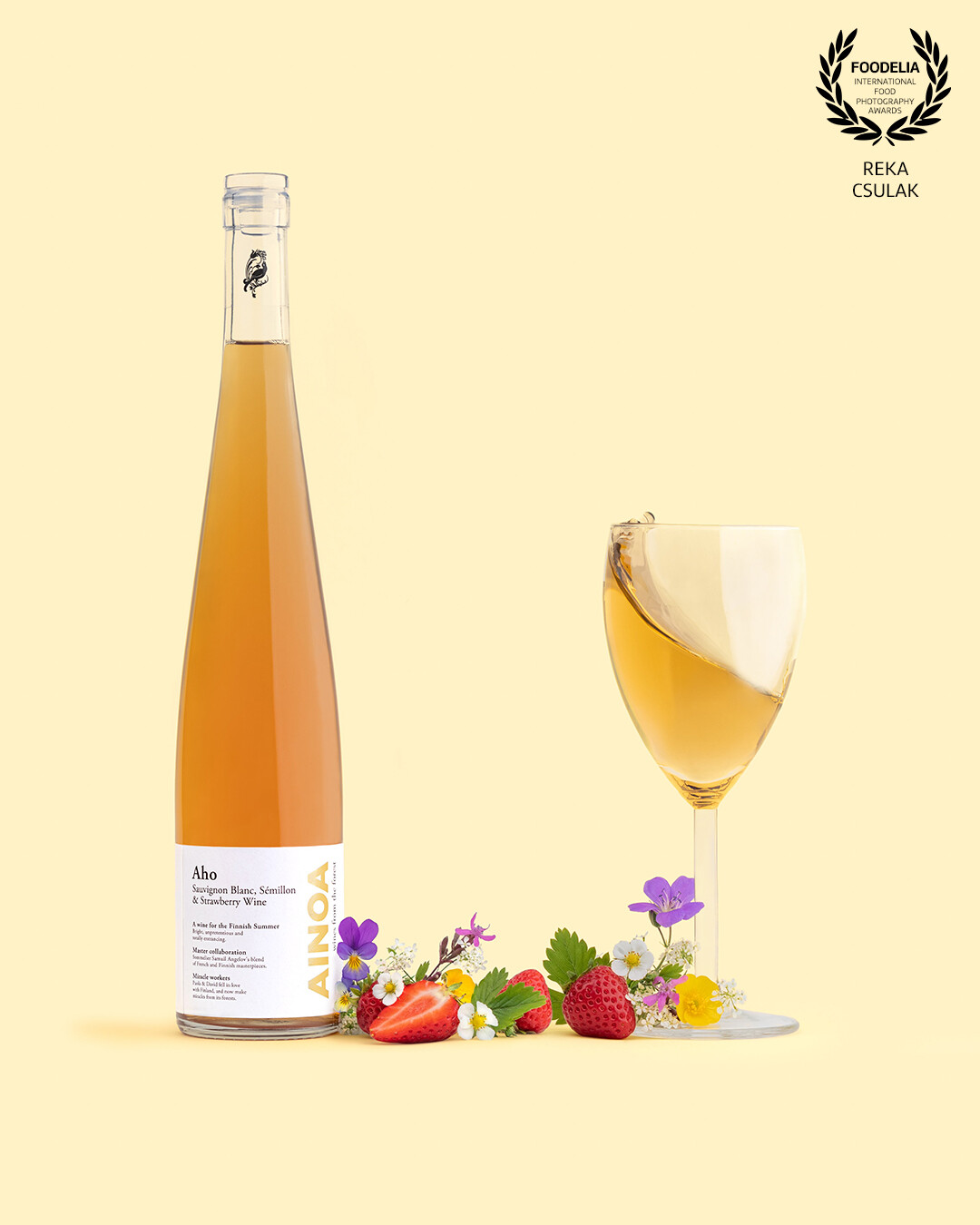 🌼 Ainoa Winery's Aho - the name literally means meadow, so I wanted to bring typical Finnish wildflowers to the scene.<br />
<br />
🥂 It is “A wine for the Finnish Summer” - as written on the label, so I set the colour palette to bring the summer vibes, and warm sunlight + incorporated a playful frozen action dedicated to every summer moment with a glass of wine.<br />
<br />
🍓 Strawberries are not only the essential element of Finnish summer but also strawberry wine is one of the main components of Aho, hence beautiful local strawberries also appear on the scene.