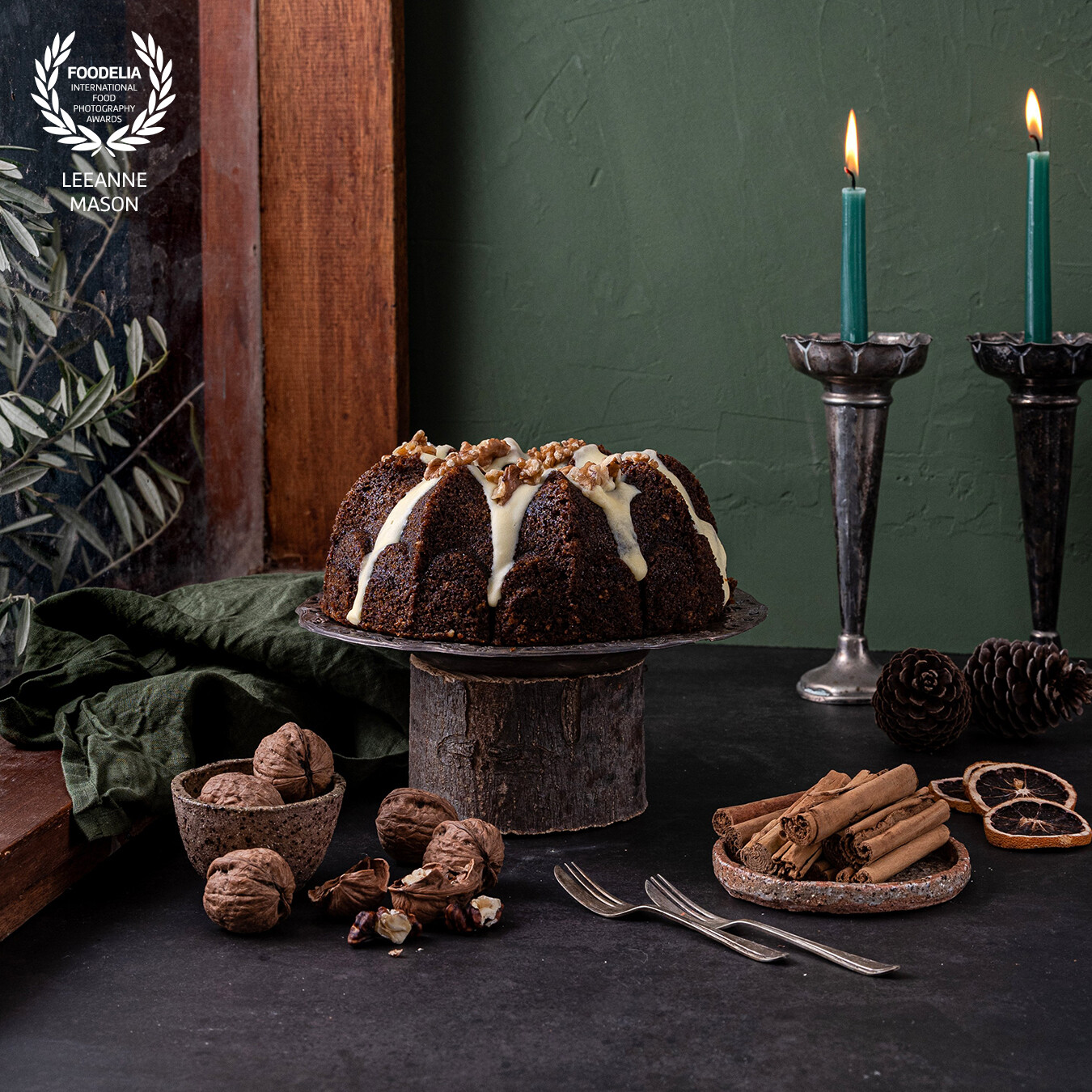I found an old window in its frame at the recycling center and a friend gave me some olive branches from her olive tree which both were used to create this scene. I angled my Godox AD300 through a scrim to emulate winter window light and to illuminate this delicious Spiced Carrot and Walnut Bundt Cake.