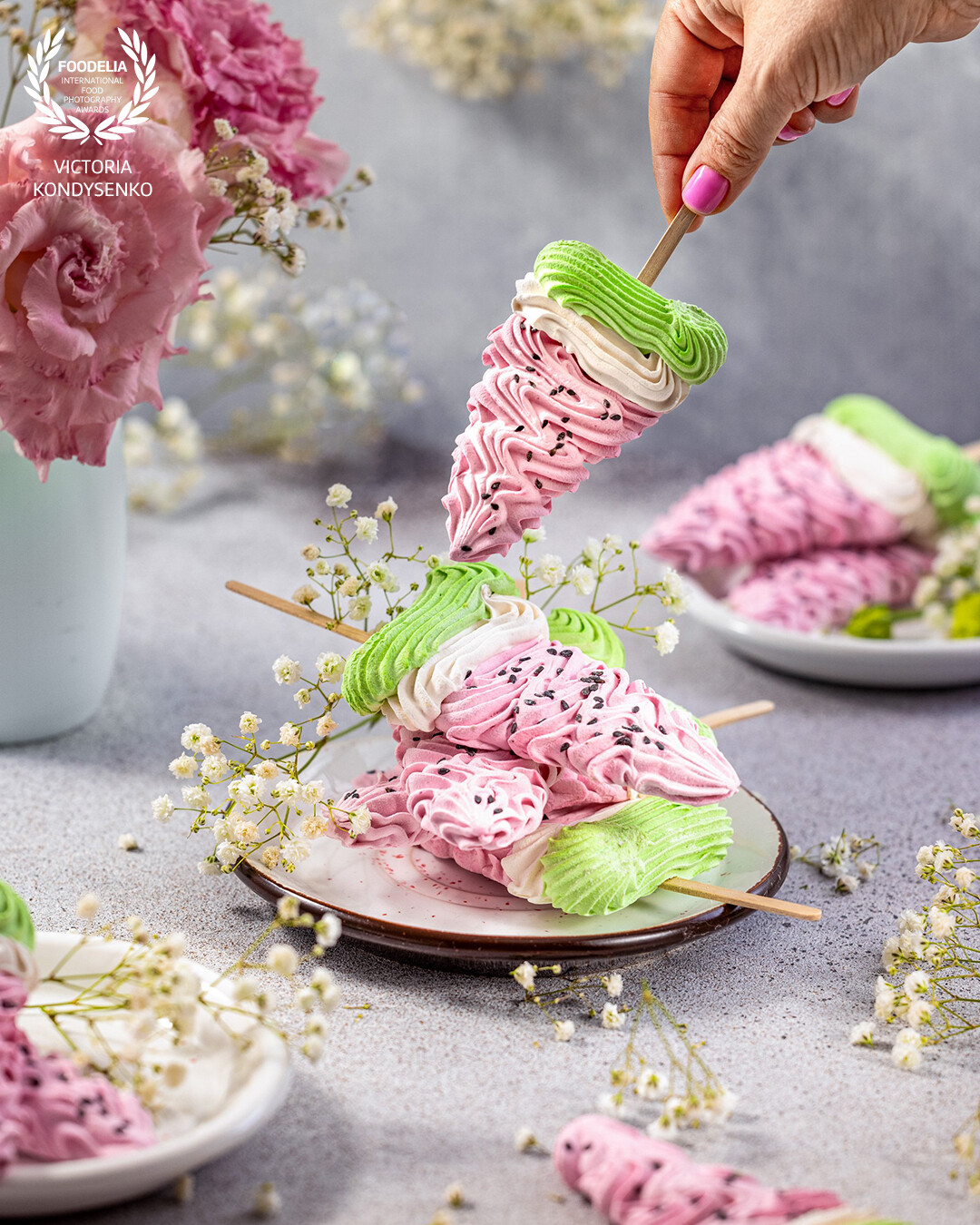 Stack of delicious homemade colorful marshmallows in the form of slices of watermelon. Advertising photo shoot of the local Ukrainian production of craft marshmallows.