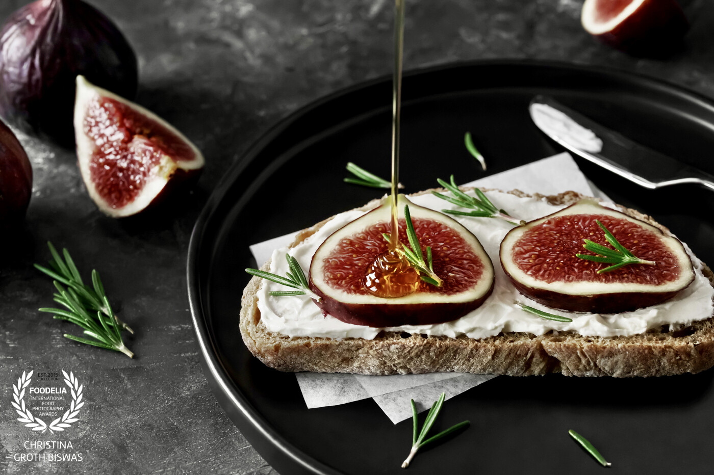 Toasted sourdough bread with cream cheese, figs and honey.