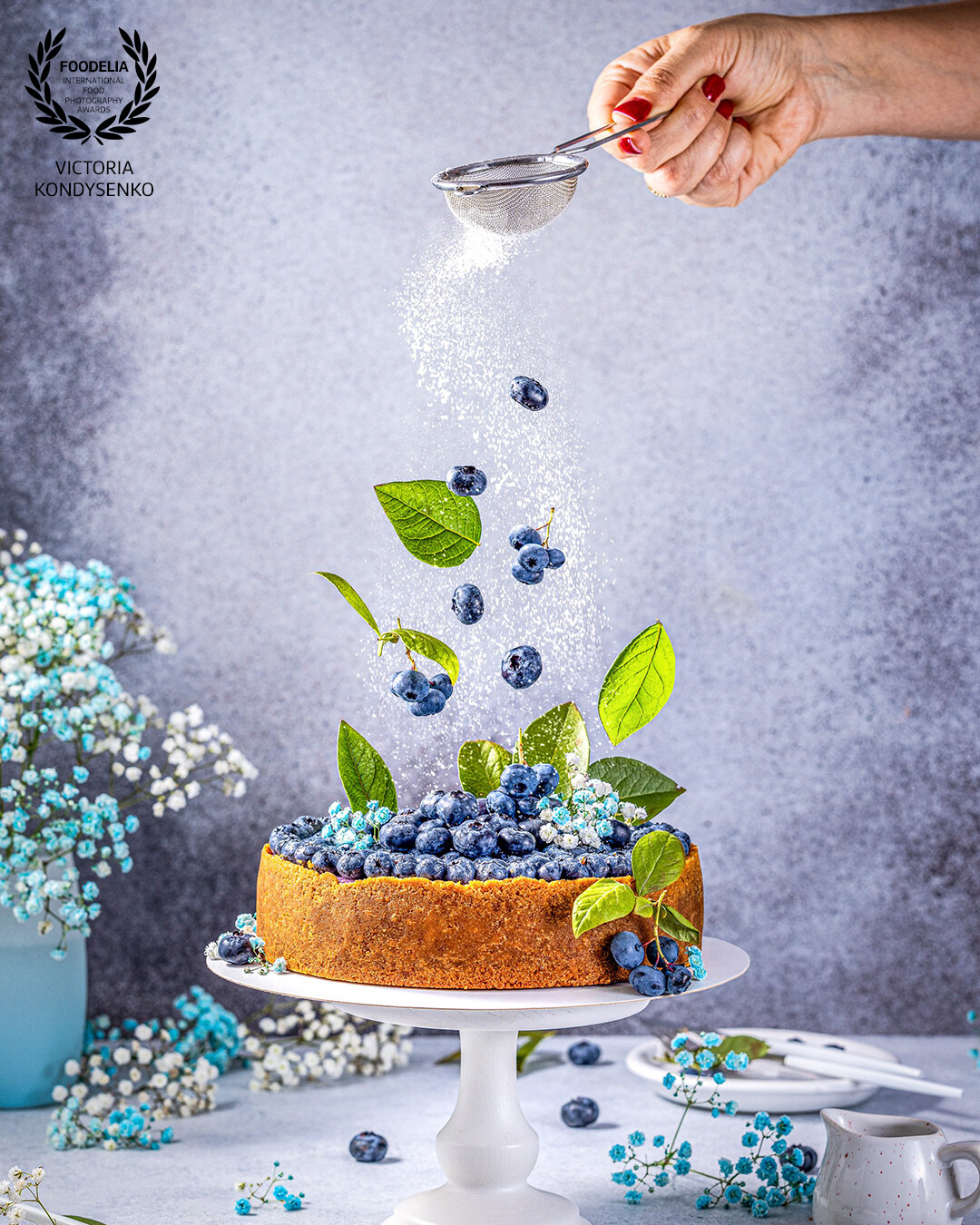Sweet creamy blueberry cheesecake with fresh blueberries and whipped cream. Shooting for pâtisserie, local Ukrainian business.