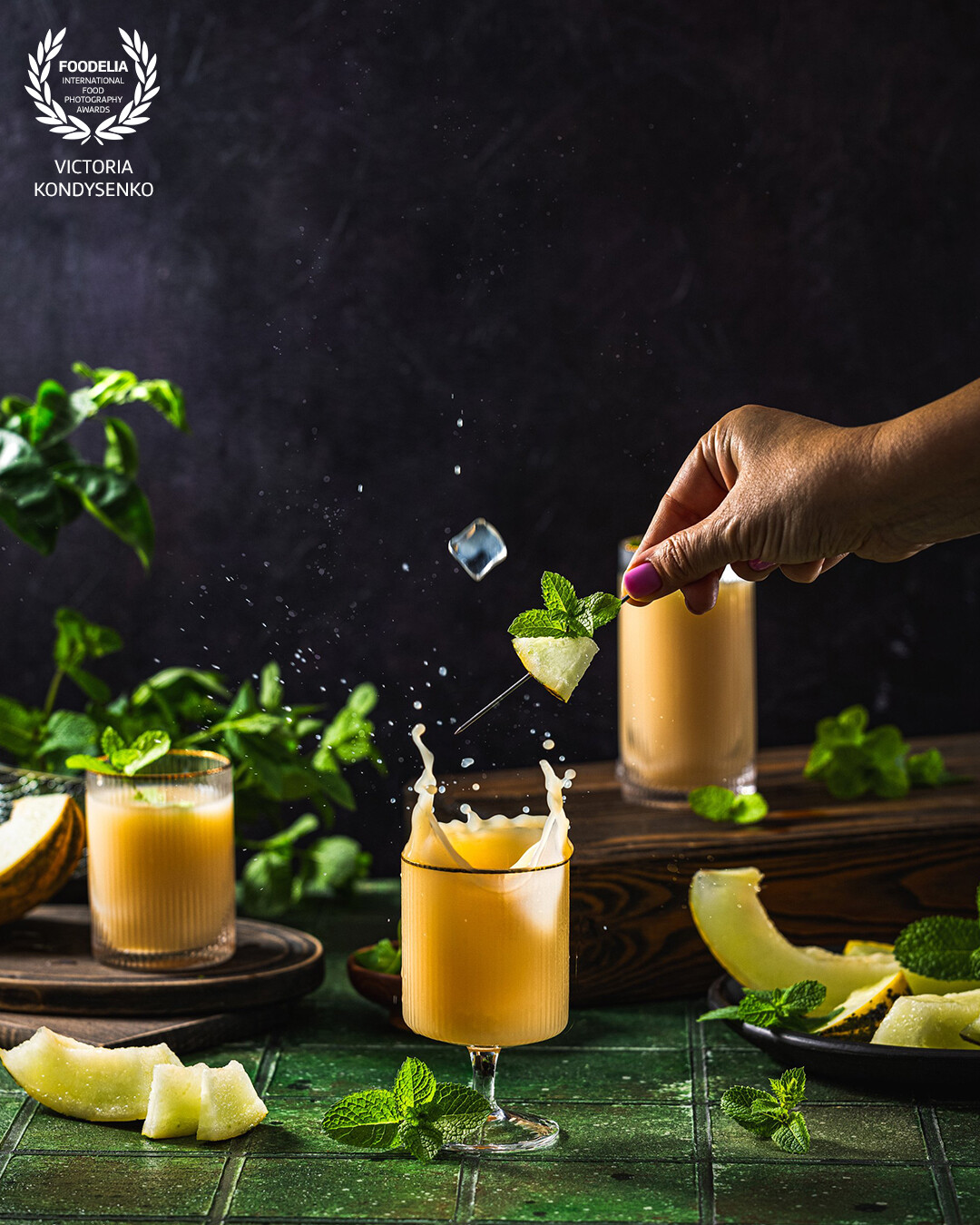 A refreshing summer melon drink. Promotional photo shoot of the local Ukrainian family cafe. Fly and splash food.