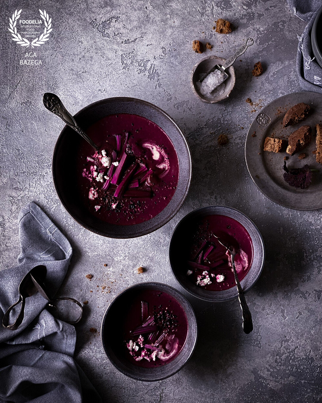 Beet soup served with sour cream and feta cheese.