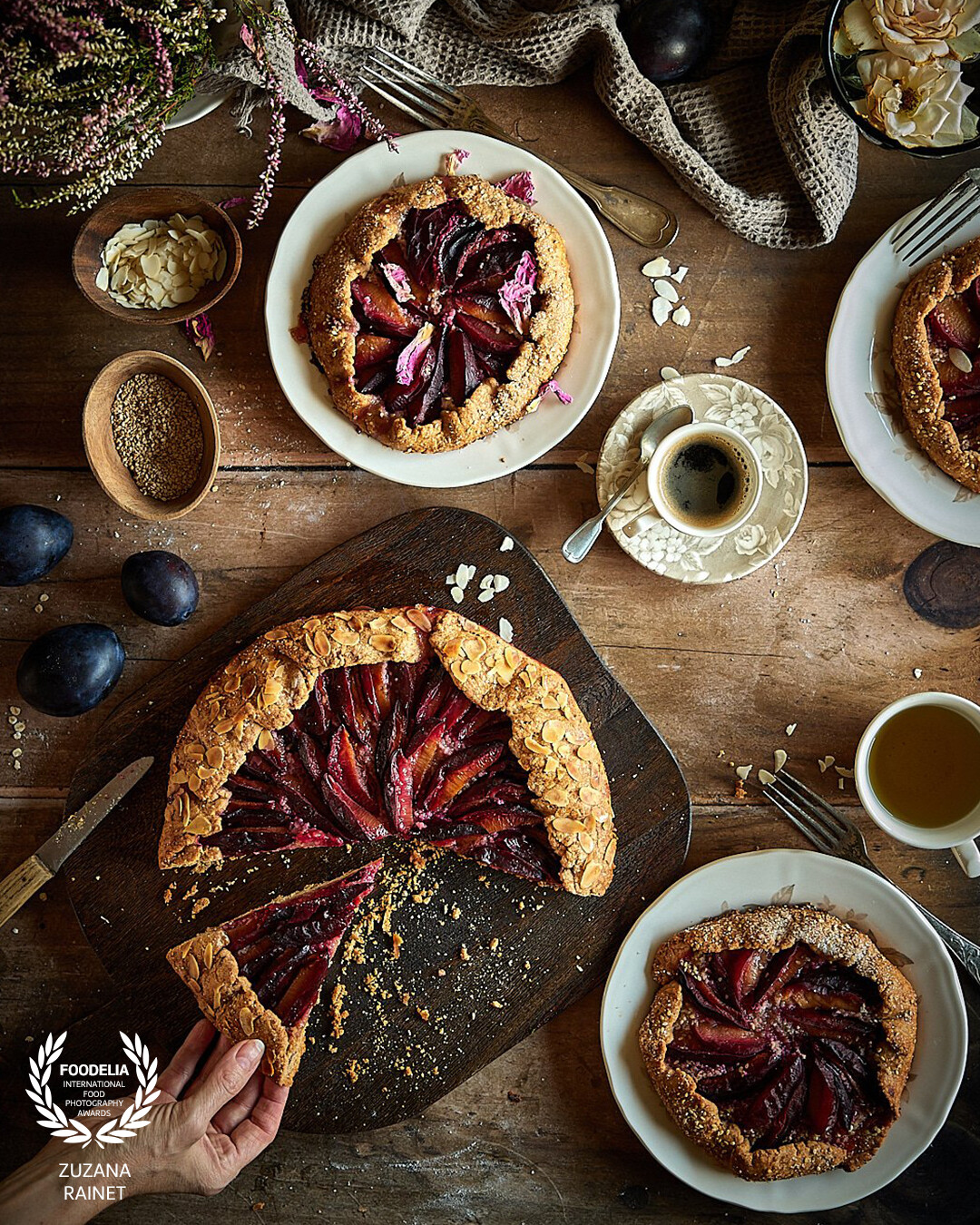 In this image I focused on capturing these home made plum galettes in a cosy rustic style using the vintage props shot a dark and moody atmosphere. My aim was to capture the galettes' structure and the fruits' juiciness. Shot with natural light.