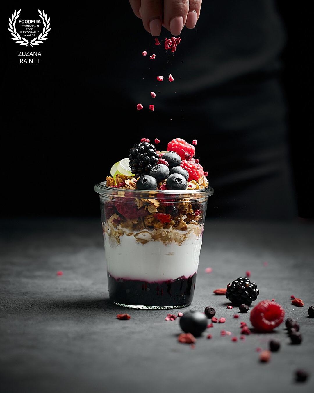 This image was shot for a client producing granola. I focused on capturing the frozen movement of granulated raspberries to enhance the taste of morning treat. Shot with the studio flash light.