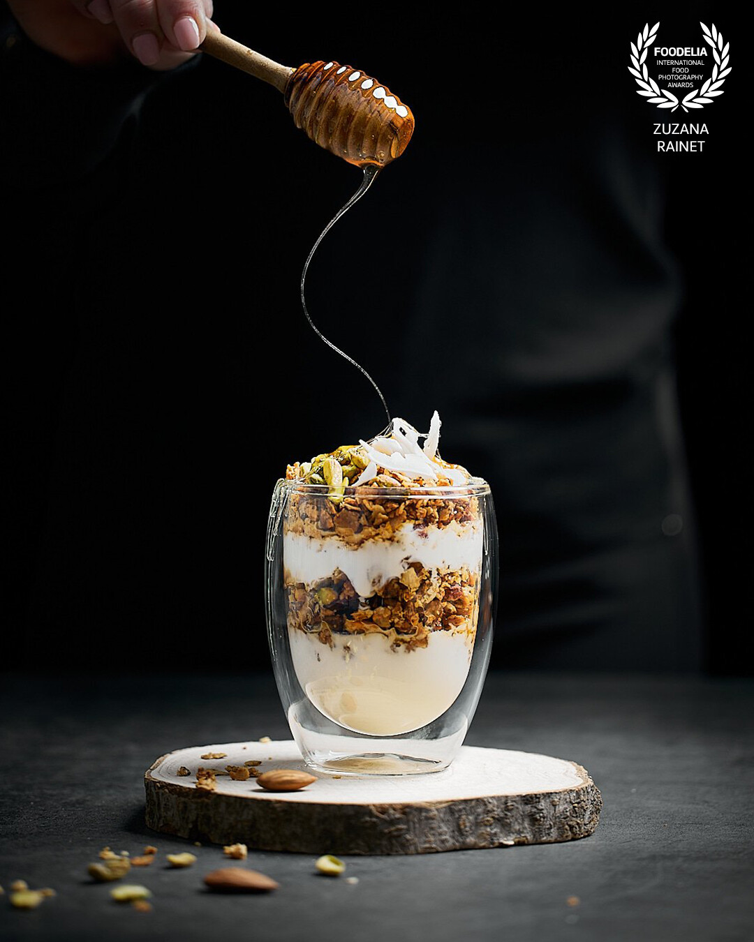 This image was shot for a client producing granola. I focused on capturing the frozen movement of honey to enhance the taste of morning treat. Shot with the studio flash light.