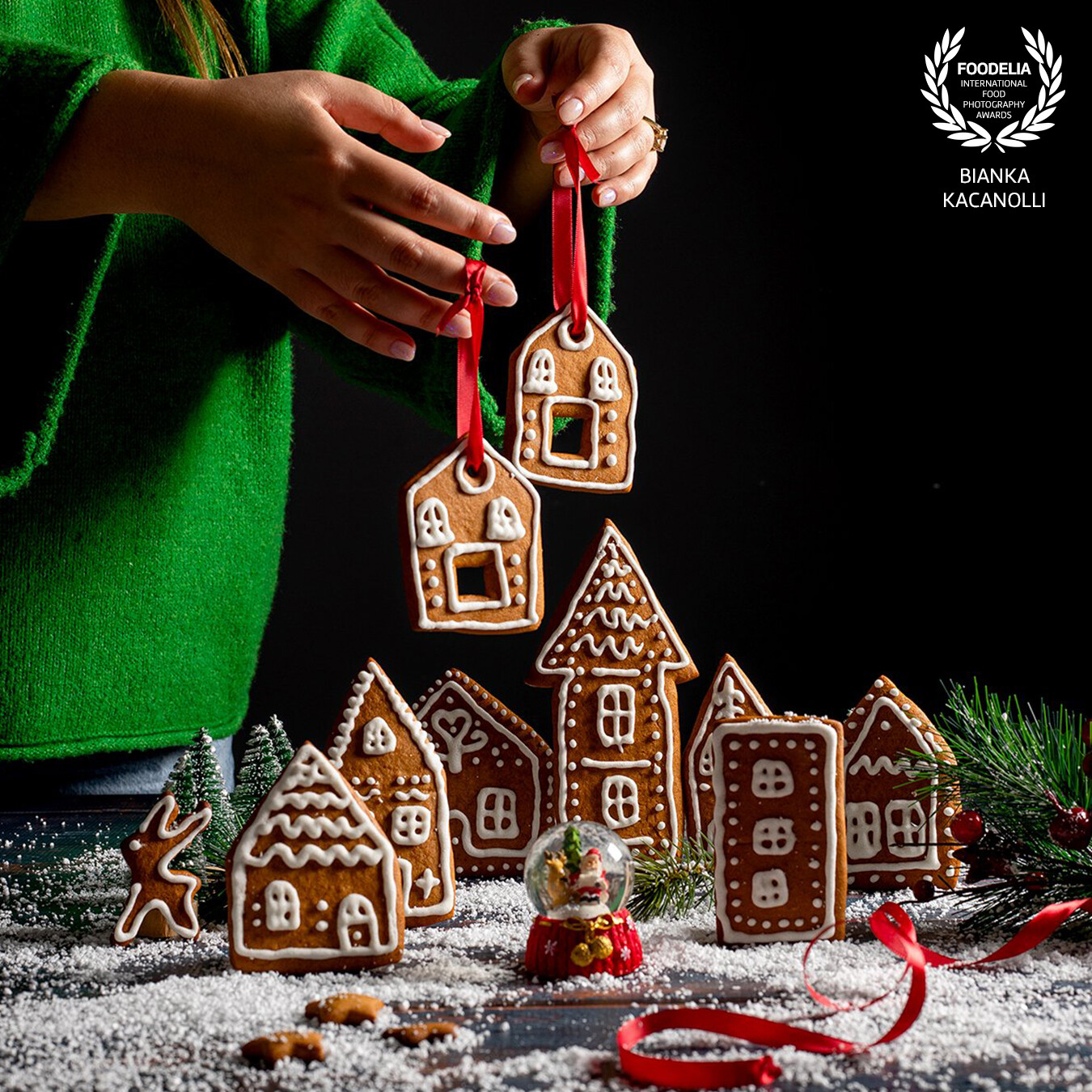 "Gingerbread house"<br />
<br />
I made these beautiful cookies  for a TVC so that they could be used by a little girl who had to put them on the tree. Since they bring a full holiday spirit, I took them back with me to the studio to make a shoot. The shooting is realised by using two different backgrounds, one of them black to give more focus on cookies and the other one wood covered by artificial snow. I Have used only one artificial light and shoot with Canon.