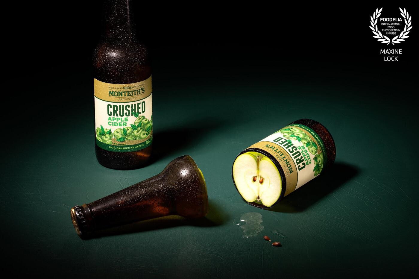 An apple cider bottle "sliced" opened and ready to be served! This time on a moody green textured background, for a little something extra!