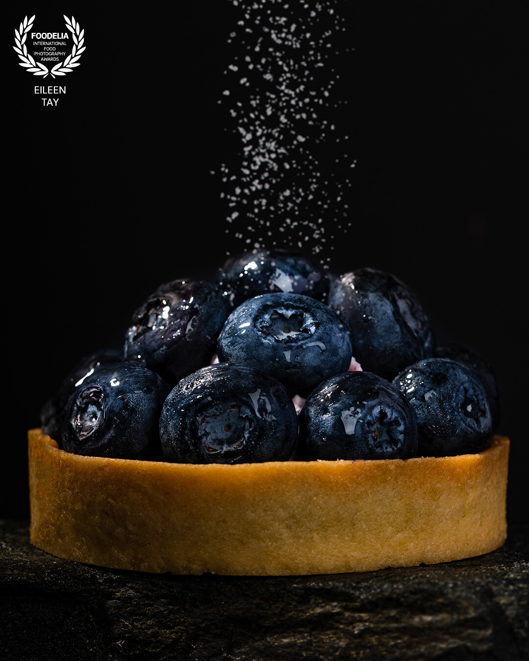Shot this photo for Kerkies Dessert, using a 90mm macro lens. Captured juicy blueberries on the tart, and the glistening droplets to enhance the overall mouthwatering appeal.<br />
<br />
The key is to make the viewer crave the tart through my photo!