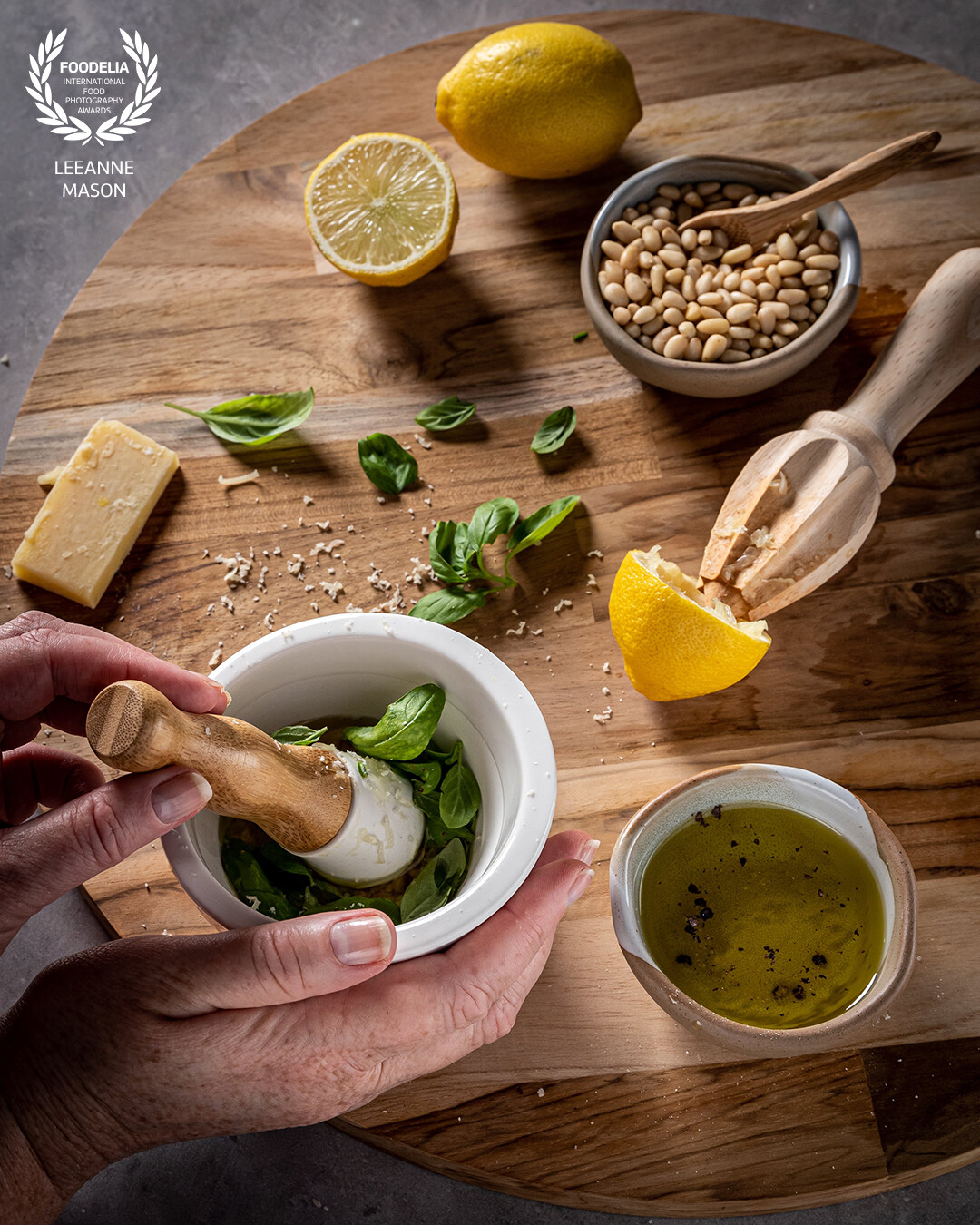 Creating something by hand is a mindful process. That's what I love about photography, being immersed in the moment.  By focusing on the manual muddling of some fresh pesto in a mortar and pestle is a methodical feeling and helps you savor the process and enjoy the end result so much more.  <br />
<br />
This was shot at a 45 degree angle with Godox AD300 lighting with a 60cm modifier and grid to create the illusion of morning light.