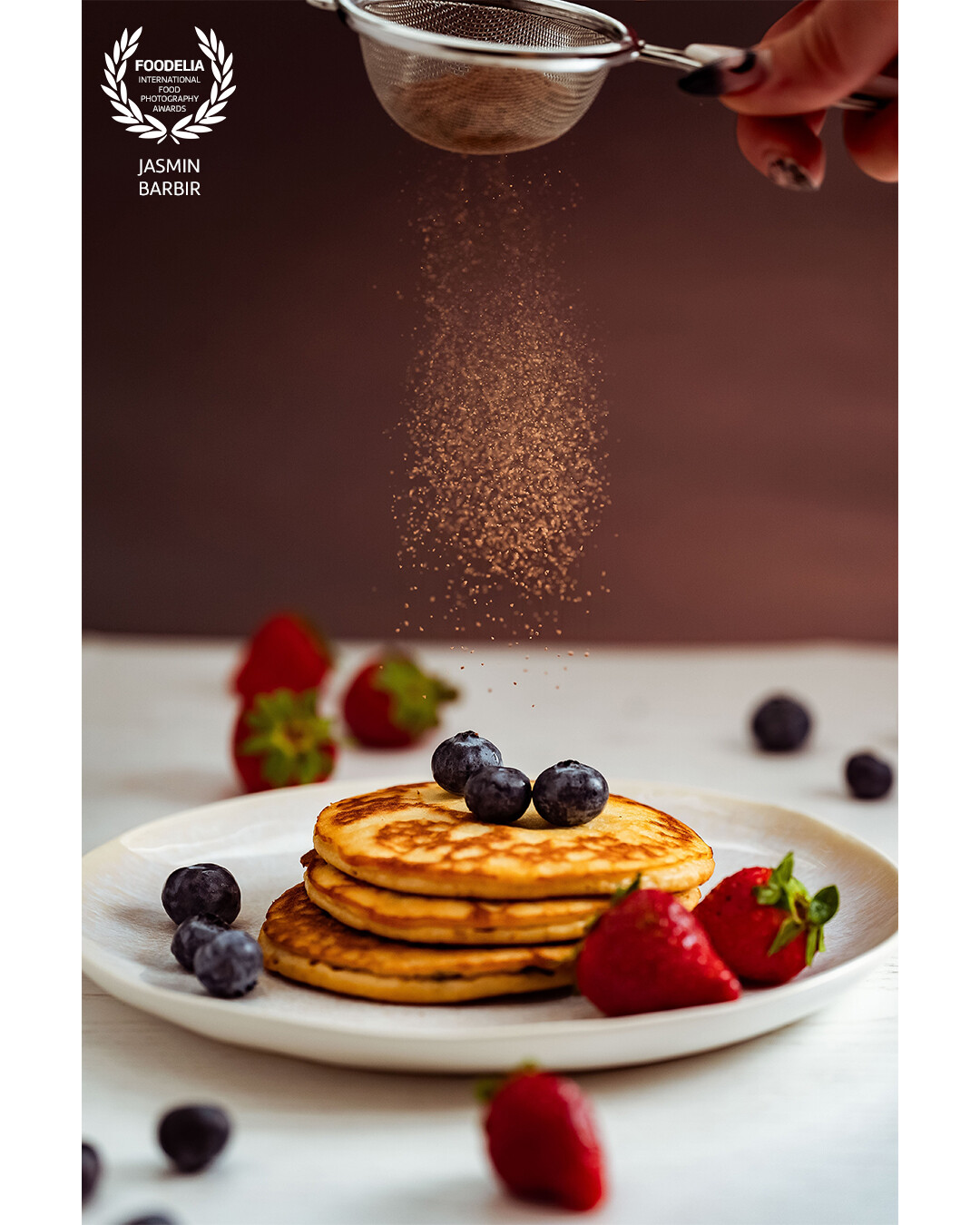 You just have to love pancakes. <br />
With a sprinkle of chocolate, fresh strawberries and blueberries on the top, who wouldn't?
