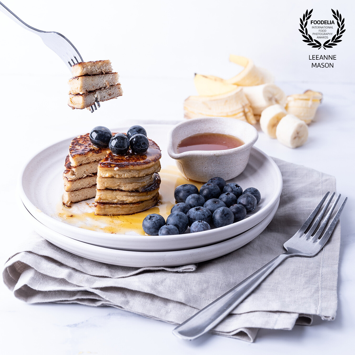 Protein packed Fluffy Banana Pancakes with Canadian Maple Syrup, delish! I used layering and composition to draw the audiences eye around the frame.