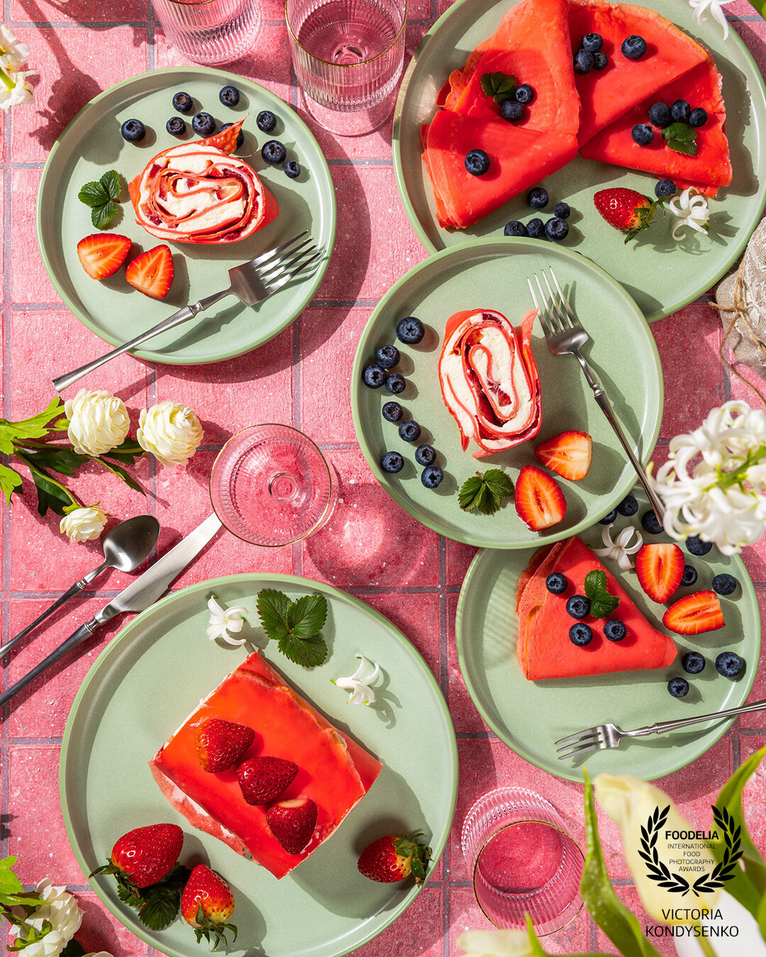 Springtime delight on a plate. Delicate crepe rolls with creamy filling, juicy berries, and a burst of vibrant flavors.