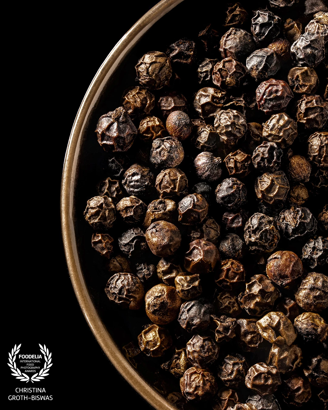 A close-up image of black peppercorns, it highlights their natural beauty and textures, elements we often overlook in our daily cooking.