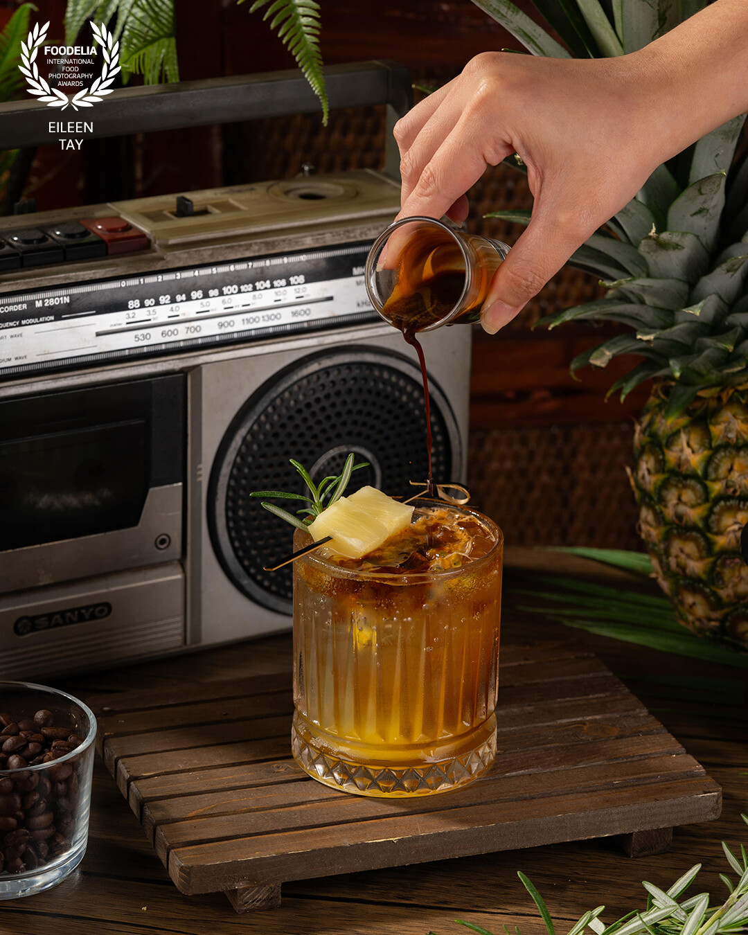 This setup channels a nostalgic Malaysian vibe with retro flair, combining warm wooden textures, tropical accents, and vintage electronics to tell a story of time, taste, and tradition.