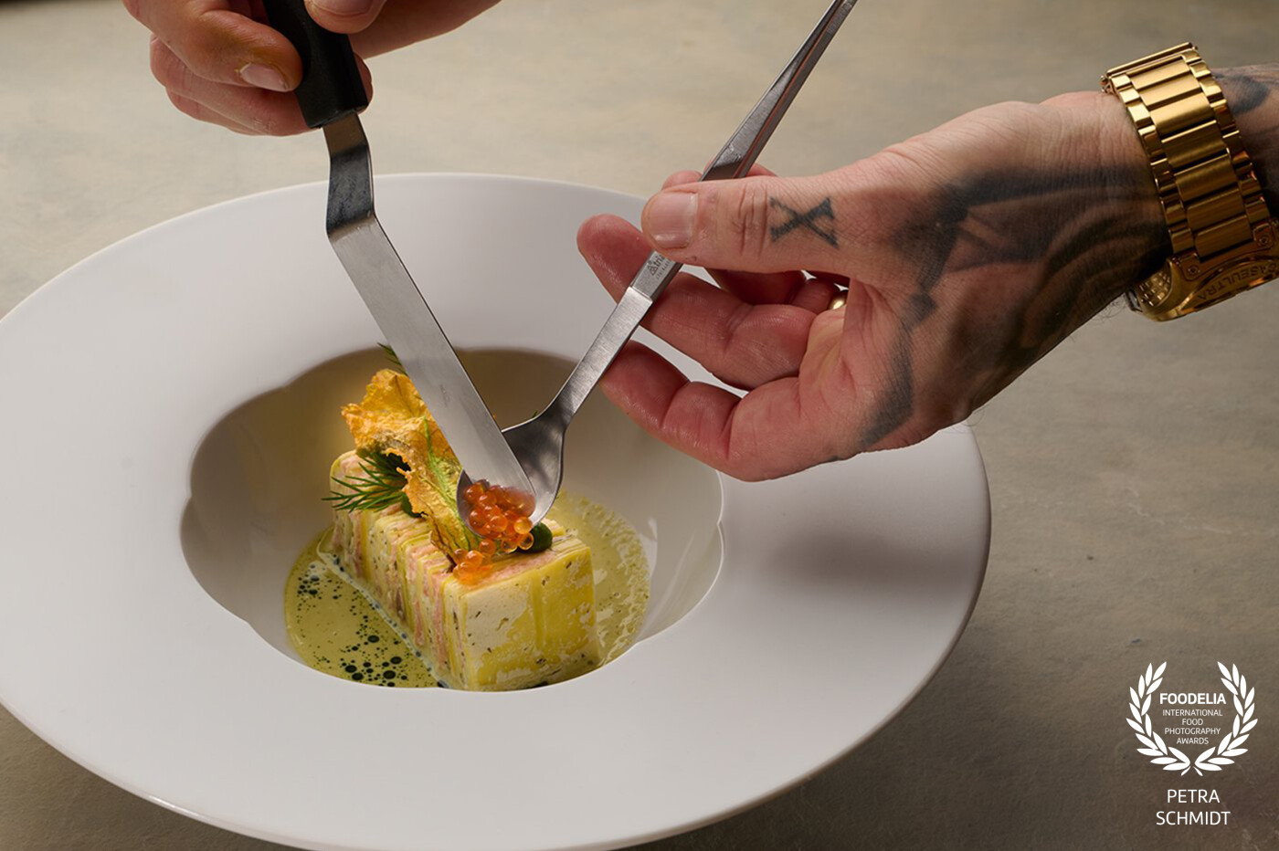 In the kitchen studio at Widbillers in Germany, light streamed softly across the stainless steel surfaces – the kind of light that invites focus, patience, and precision.<br />
There, Munich-based chef Kaan Erbatu was deep in the process of plating one of his signature dishes. Every movement deliberate, every detail considered.<br />
As he placed the final pearls of caviar with calm intensity, I captured this exact moment – a moment where craft meets emotion.<br />
This photo was created for “Zu Gast” magazine, but to me, it tells more than a story for print – it captures the spirit of collaboration and the beauty of culinary expression.<br />
It was a true honour to witness and preserve this scene through my lens.