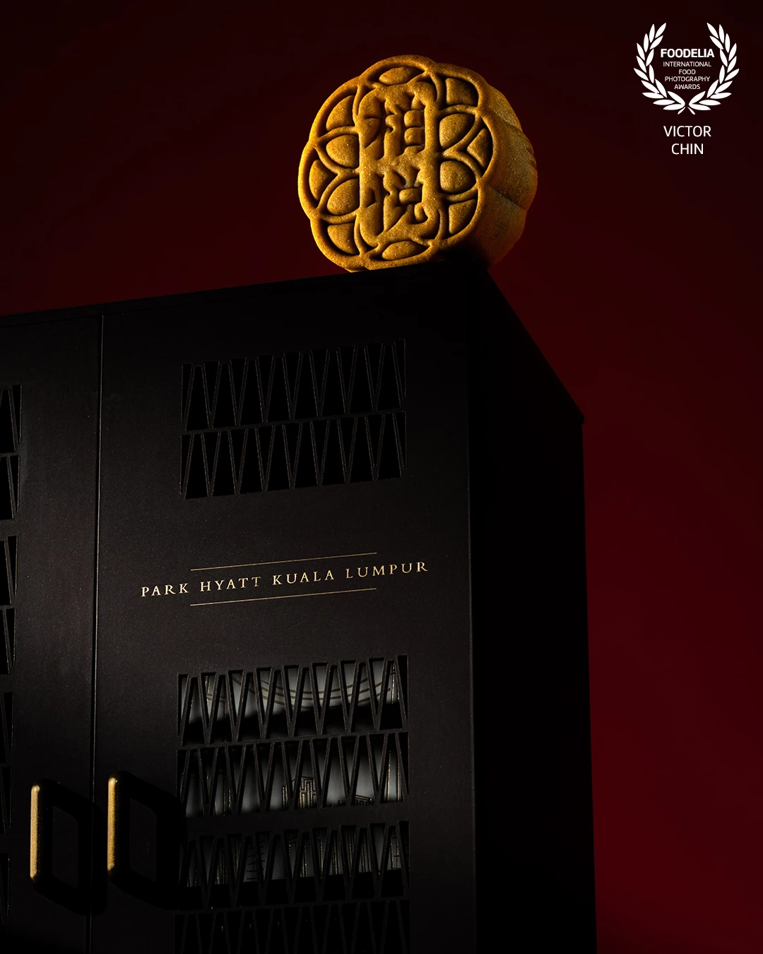 Shot for Park Hyatt Kuala Lumpur’s exclusive mooncake collection, this image merges heritage with modern luxury. Using dramatic lighting against a deep red backdrop, the composition draws attention to the intricate mooncake design and the refined packaging. The clean, minimalist aesthetic reflects the brand’s sophisticated identity while honoring the cultural significance of the Mid-Autumn Festival. As a food photographer based in Malaysia, I aimed to balance cultural storytelling with elegant visual execution to elevate this festive creation.