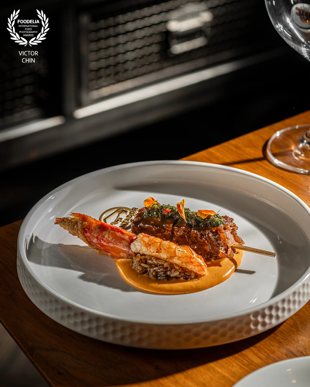 Captured in natural directional light, this shot highlights the elegance and craftsmanship behind Vantador’s modern steakhouse cuisine. With a focus on texture, depth, and refined plating, the image showcases a luxurious surf-and-turf presentation that reflects the restaurant’s Michelin-level precision. Shot on location to preserve the authentic ambiance of the space.