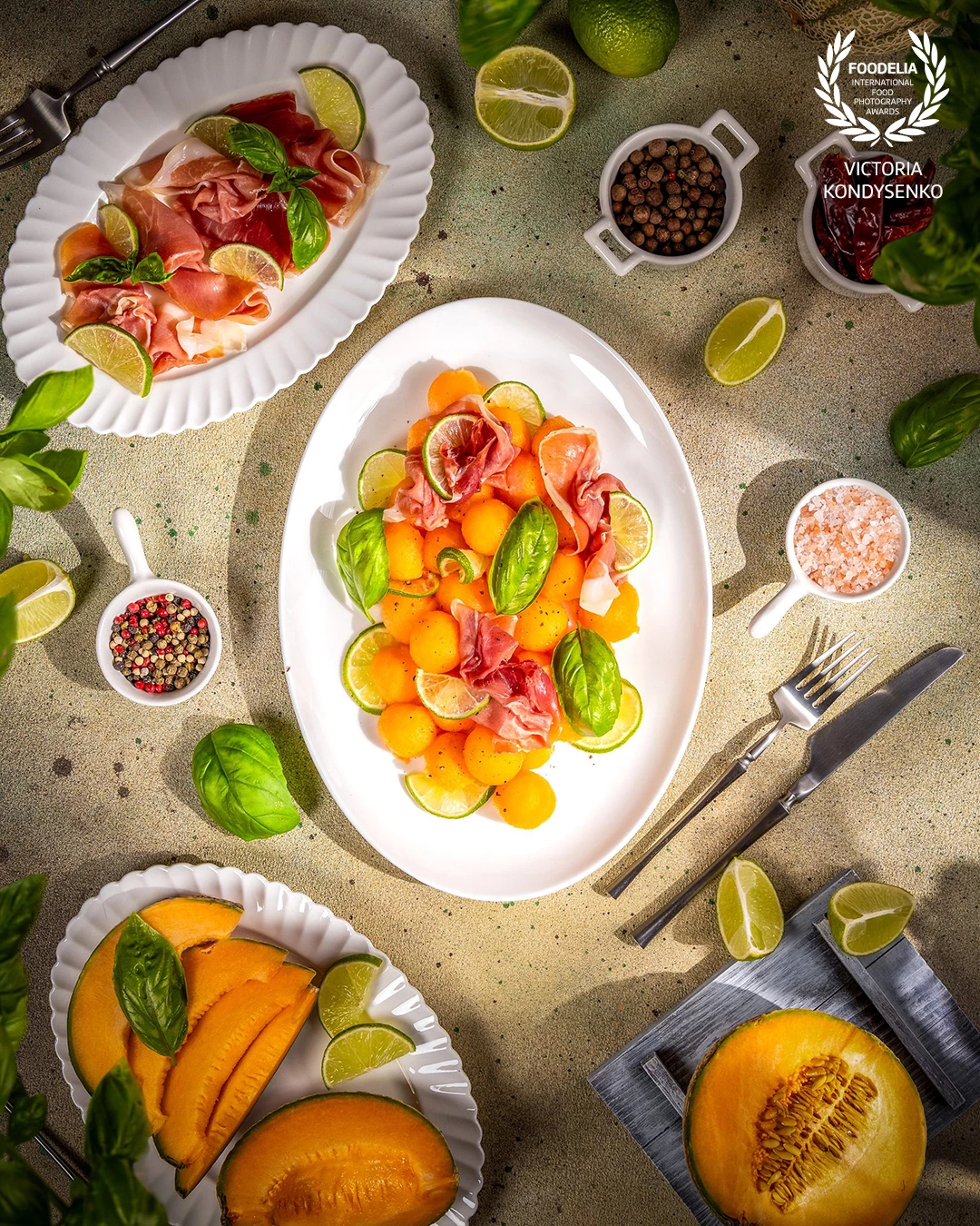 Refreshing summer cantaloupe salad featuring prosciutto, zesty lime, fresh basil, and a dash of pepper, creating a colorful and delicious dish perfect for warm days