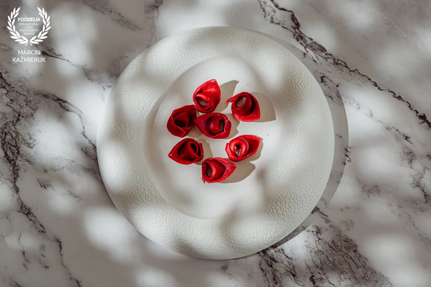 Dish created by chef Miroslaw Jadach.<br />
<br />
Red tortellini stuffed with ricotta, spinach and parmesan with a buttery demi-glace<br />
<br />
@marcin4funphotos<br />
@chef_jadach<br />
@fotofoodie<br />
@nikon_pl @nikoneurope @nikonusa @godox_global<br />
@finedineeurope