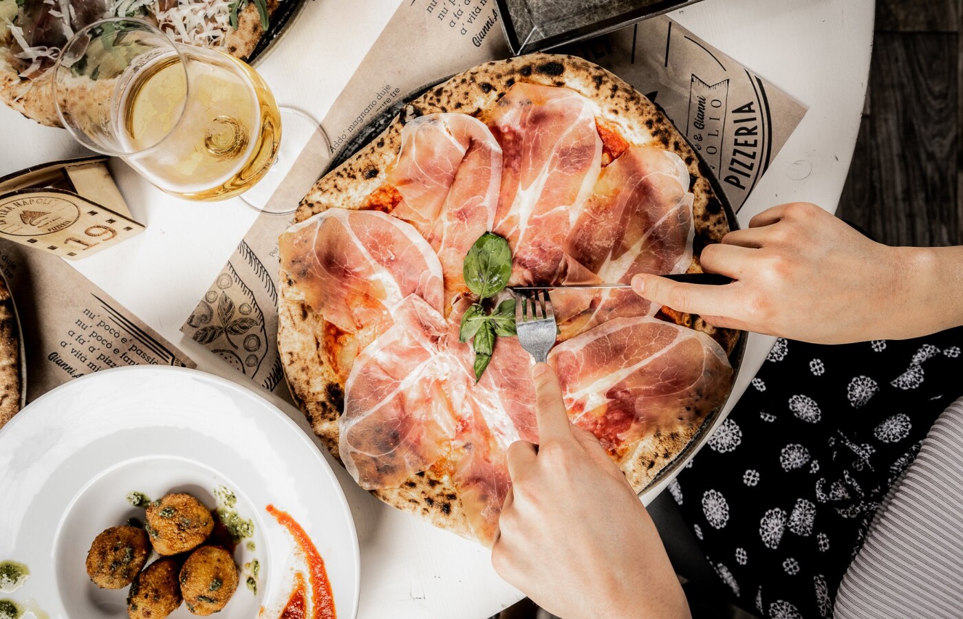 A taste of Parma on your table!Pizza with Parma ham is an experience of Italian conviviality, served...