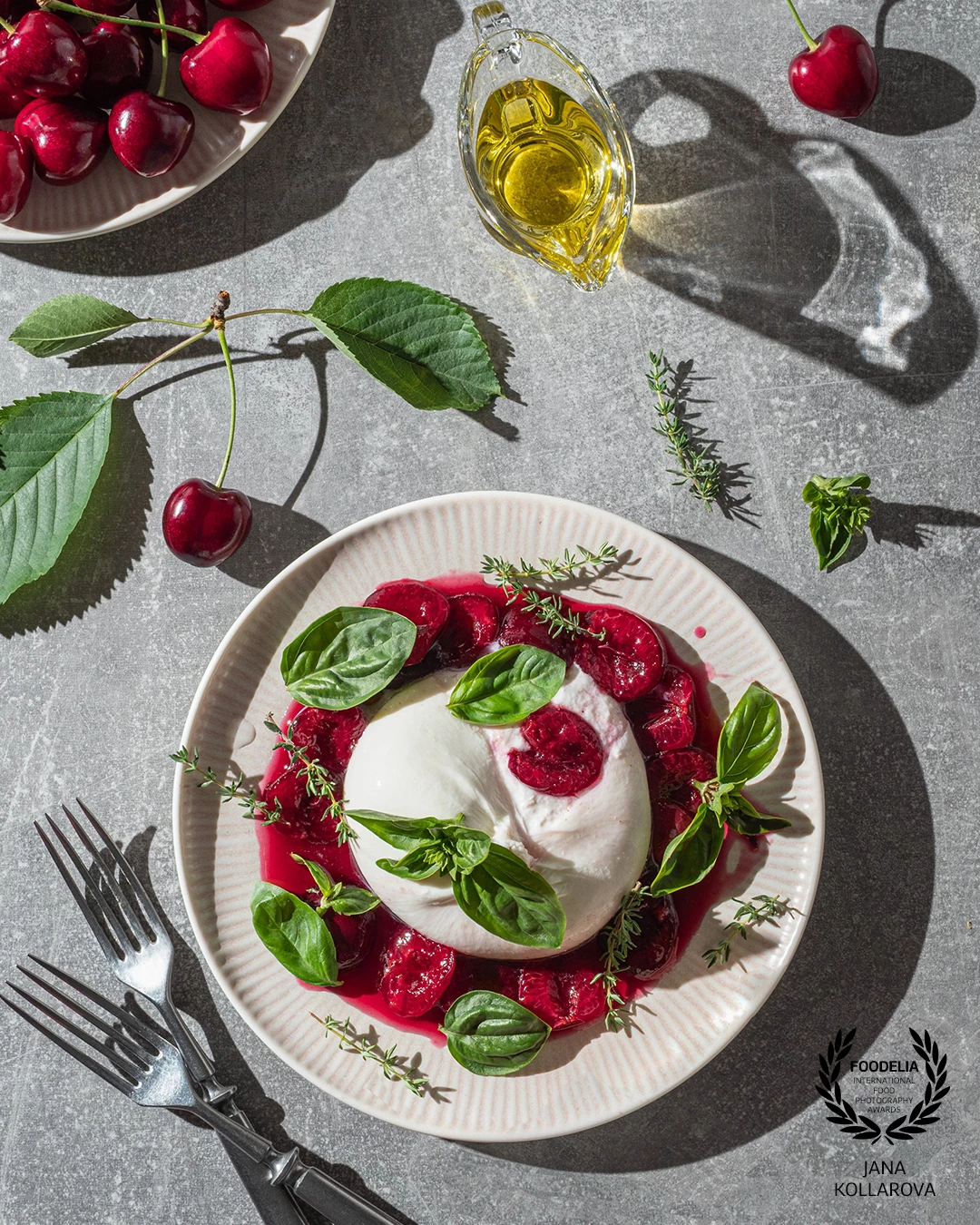 Summer elegance on a plate – creamy burrata paired with sweet cherries, fresh basil, and a drizzle of olive oil. A play of light and texture that celebrates seasonal simplicity.