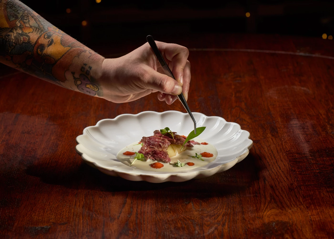 Grilled pluma, served on a pecorino fondue with smoked potato and drops of tomato.
This image was cr...