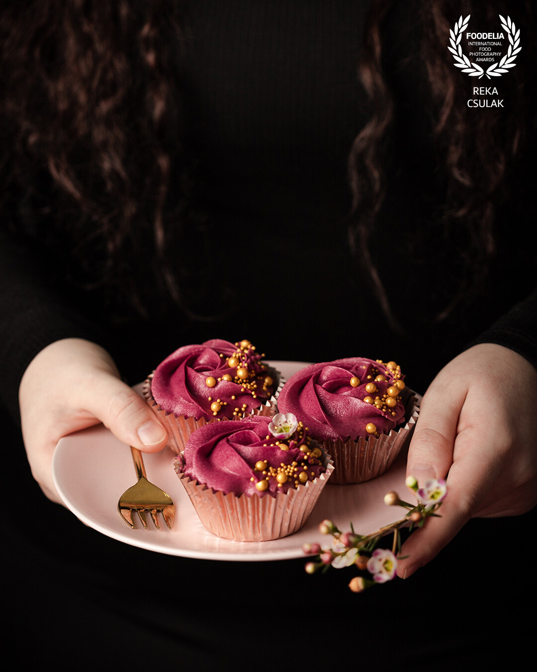 Cupcakes with vibrant pink frosting call for Spring, and are even more relatable by the human touch.