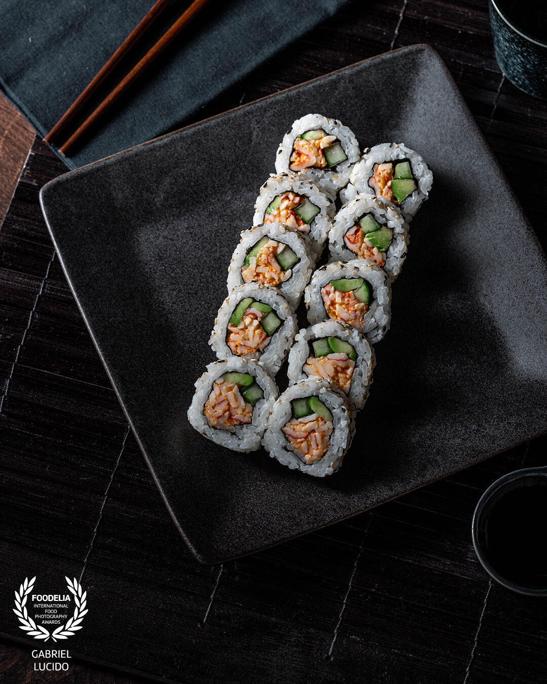 This sushi was Food Styled by Elizabeth Normoyle. This photo was taken using soft light which was blocked off at the top and bottom of the frame to achieve a natural vignetting effect.