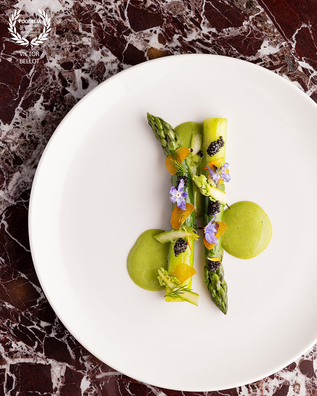 Asparagus, bottarge, caviar and flower imagined by chef Jimmy Elisabeth for the restaurant Voyage Samaritaine in Paris.