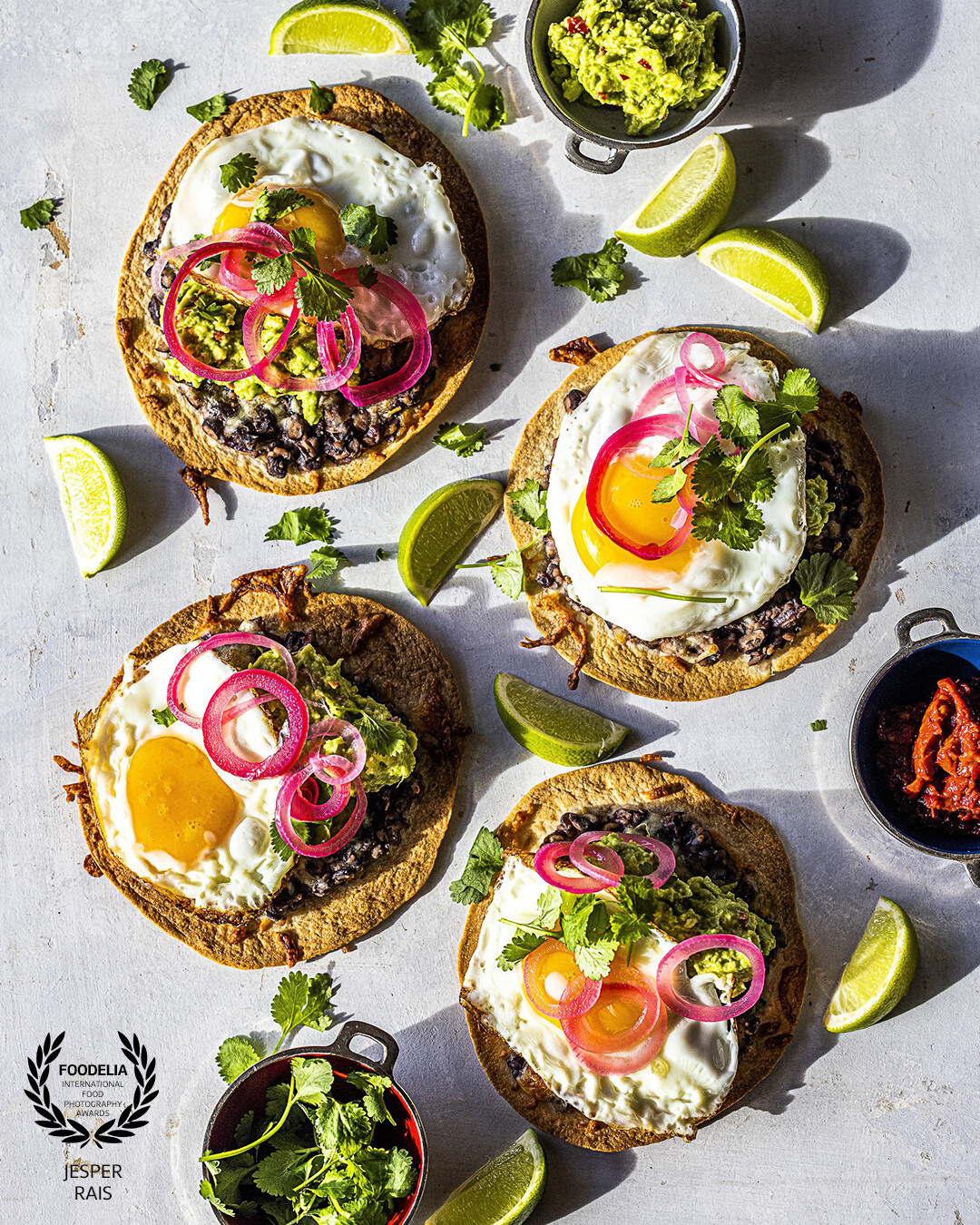 Tostadas with beans and fried egg. The food is cooked and styled by me, from my new own cookbook "SparMig!" with budget friendly food for times when everything costs a little extra.